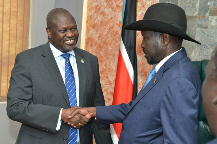 South Sudan's President Salva Kiir (right) shake hands with rebel leader Riek Machar in a rare September 2019 meeting in Juba