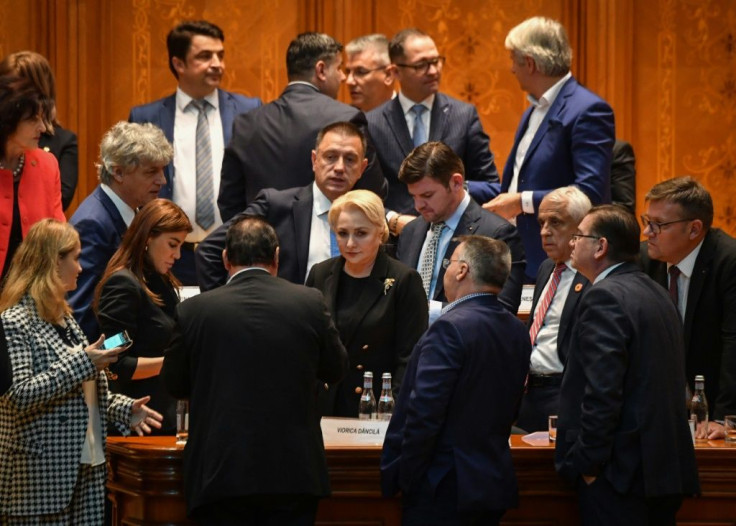 Dancila, centre, is seen with members of her cabinet after the no-confidence vote brought down the government