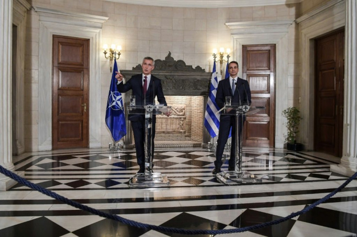 NATO's General Secretary Jens Stoltenberg (L) speaks next to Greek Prime Minister Kyriakos Mitsotakis during a press conference after their meeting in Athens on October 10, 2019
