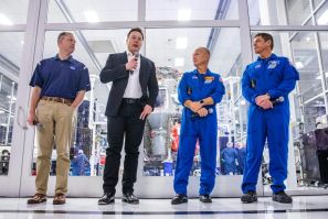 (L-R) NASA Administrator Jim Bridenstine, SpaceX founder Elon Musk, and astronauts Doug Hurley and Bob Behnken speaking during a news conference at SpaceX headquarters in Hawthorne, California on October 10, 2019