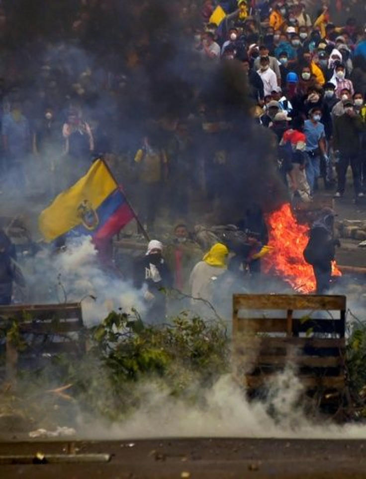Demonstrators block a road in Ecuador's capital Quito on Friday during protests over a fuel price hike ordered by the government to secure an IMF loan