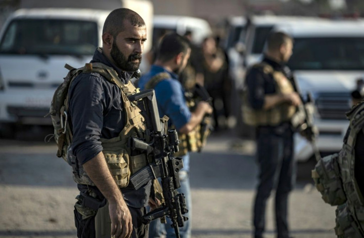 Members of the special forces of the Kurdish-led Syrian Democratic Forces (SDF) prepare to join the fight against Turkey
