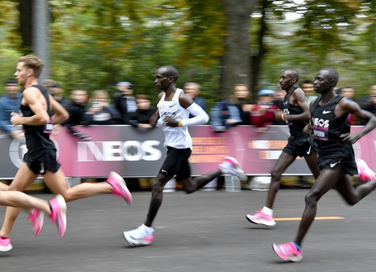 Kipchoge (white jersey) during his history-making run