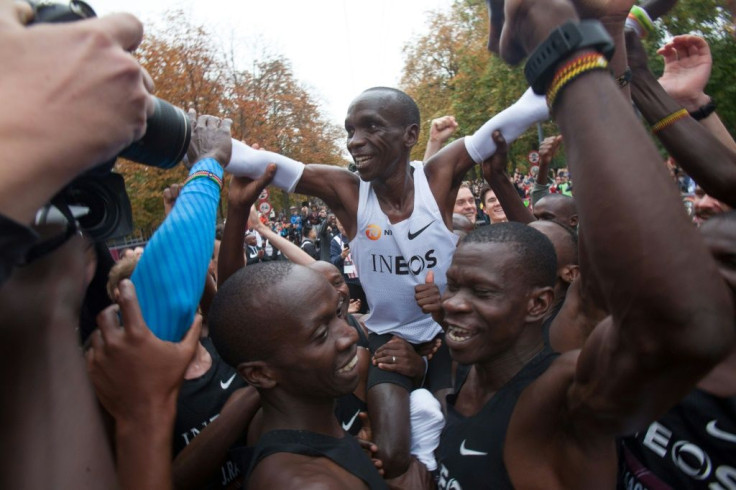 Kipchoge carried in triumph after his historic feat