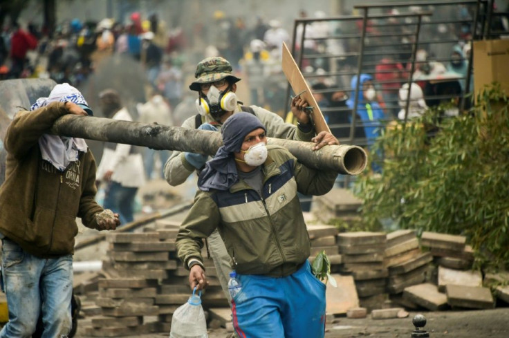 Demonstrators set up barricades near the National Assembly in Quito during protests over a fuel price hike on October 12, 2019