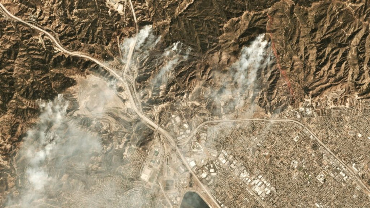 Smoke from the Saddleridge fire about 20 miles north of downtown Los Angeles is seen in this image from Planet Labs Inc