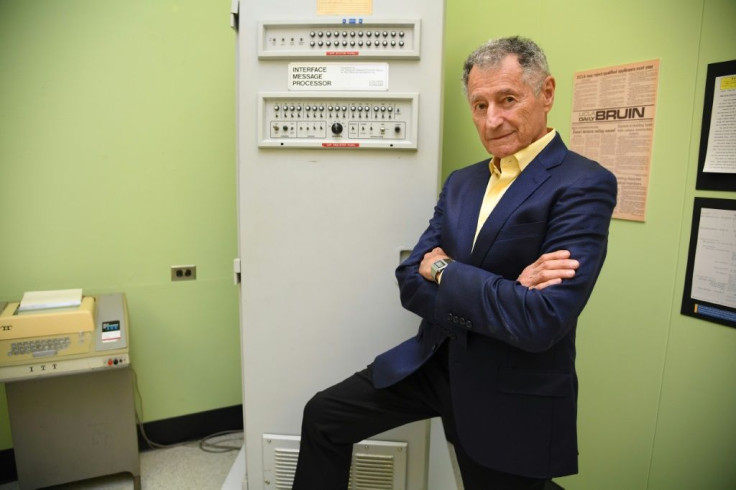 Leonard Kleinrock poses beside the first Interface Message Processor (IMP) in the lab where the first internet message was sent, at the University of California Los Angeles