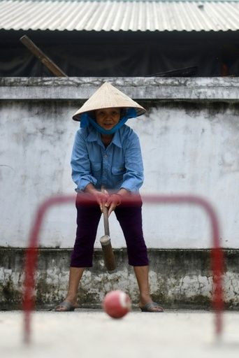 The seniors play with handmade metal and wood mallets and balls imported from China