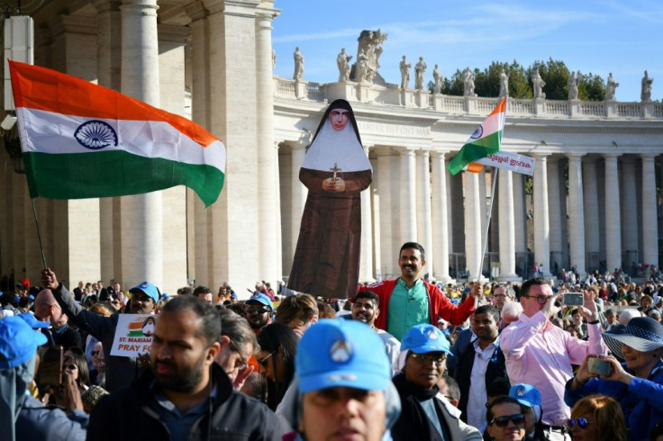 Giant portraits of the new saints were hung from Saint Peter's Basilica for the canonisation ceremony which attracted tens of thousands of pilgrims
