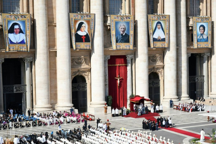 Giant portraits of the new saints were hung from Saint Peter's Basilica for the ceremony which attracted tens of thousands of pilgrims