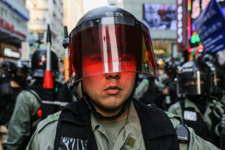 Throughout the day, Hong Kong police found themselves berated and heckled by bystanders as they made arrests