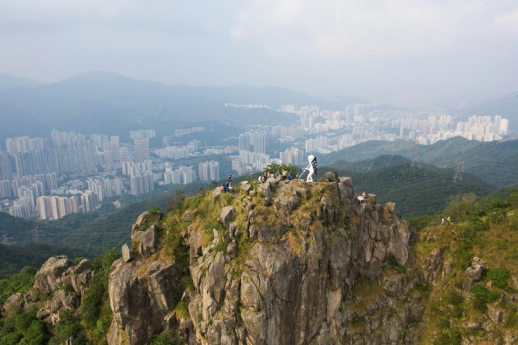 A four-metre statue known as "Lady Liberty" is placed by pro-democracy protesters on the top of Lion Rock, a Hong Kong landmark