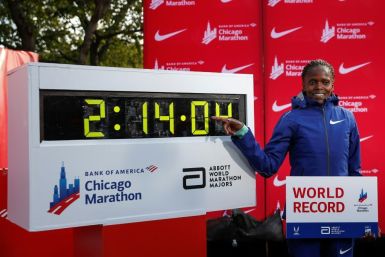 Kenya's Brigid Kosgei smiles after winning the women's 2019 Chicago Marathon with a world record of 2:14:04