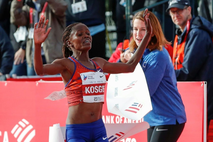 Kenya's Brigid Kosgei breaks the tape as she wins the 2019 Chicago Maraton in a world record of 2:14:04