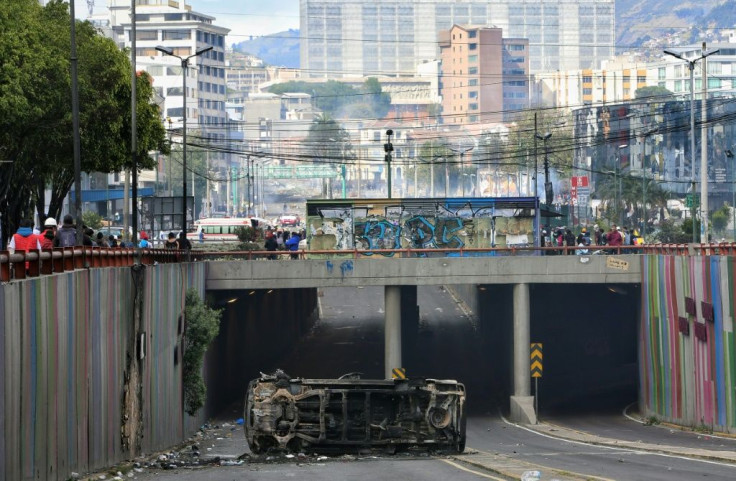 View of a damaged vehicle, following a 10-day protest over a fuel price hike ordered by the government to secure an IMF loan, in Quito on October 13, 2019