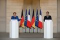 French President Emmanuel Macron (L) and German Chancellor Angela Merkel call for an end to the Turkish offensive in Syria