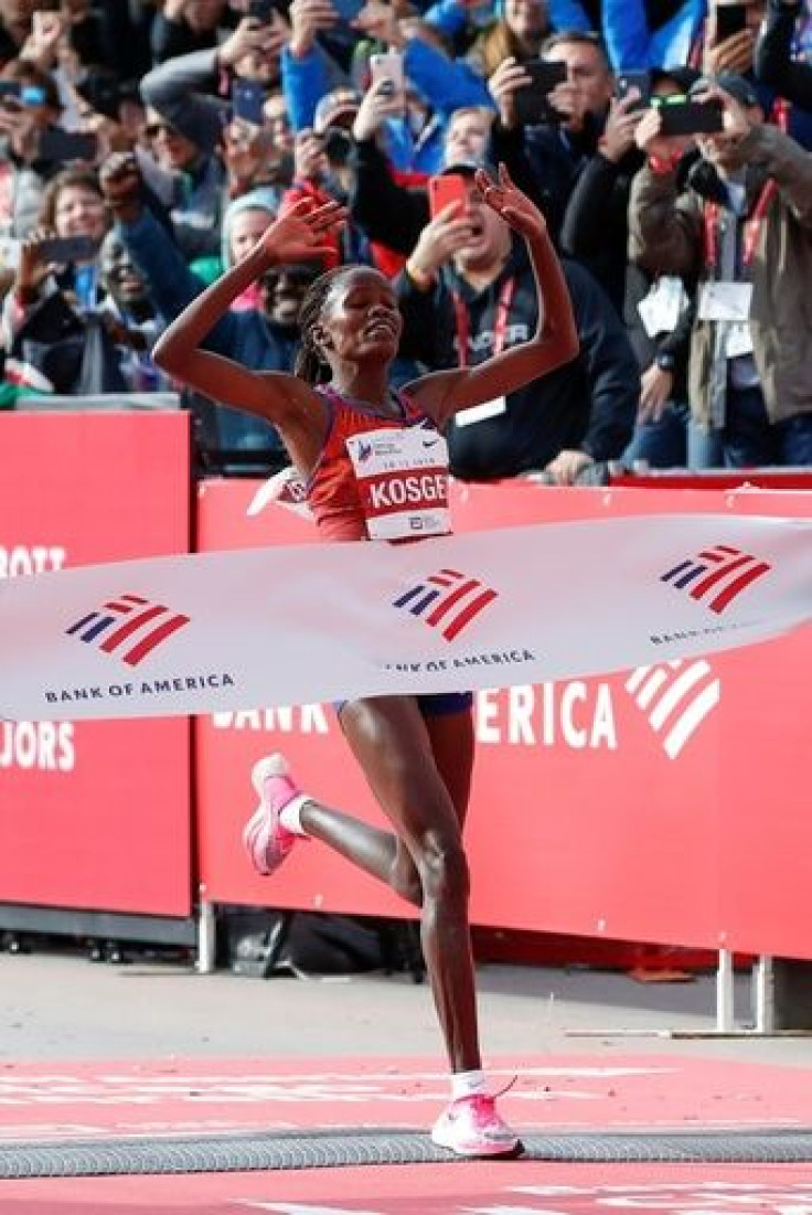 Kenya's Brigid Kosgei breaks the tape in the 2019 Chicago Marathon in a world record time of 2:14:04