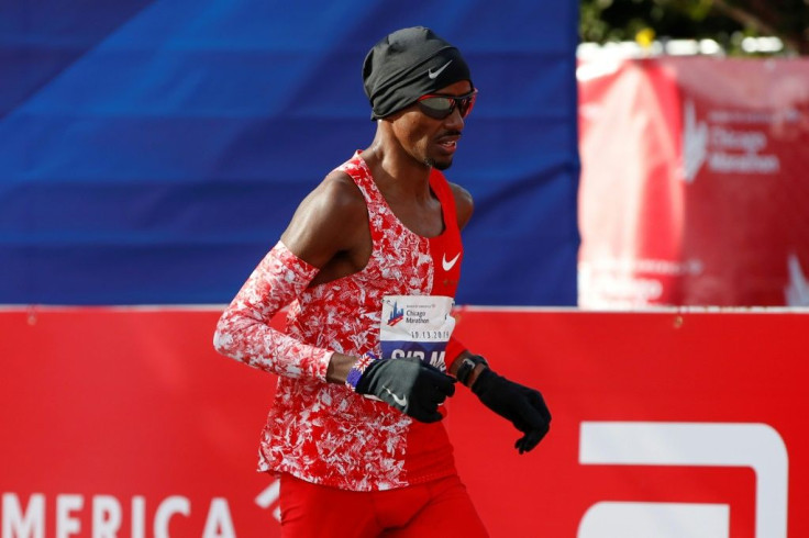 2018 winner Mo Farah crosses the Chicago Marathon finish line a distant eighth behind winner Lawrence Cherono of Kenya