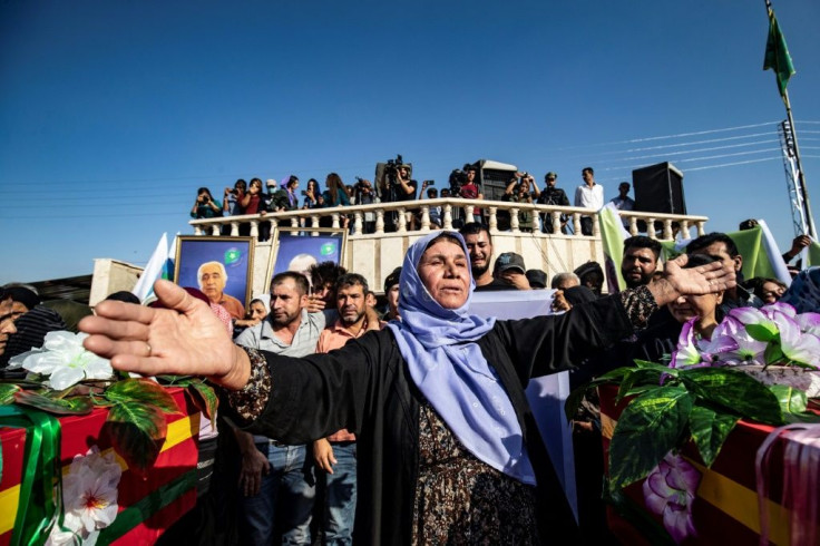 Mourners attend a funeral for Kurdish political leader Hevrin Khalaf and other Kurdish casualties