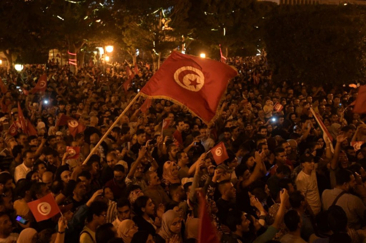 Tunisians celebrate the victory of Kais Saied in the country's presidential polls runoff