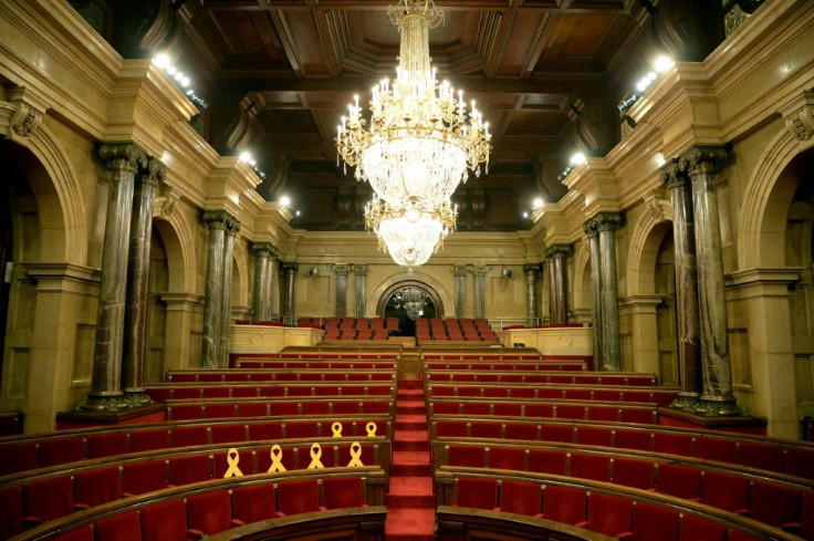 Inside the Catalan parliament, yellow ribbons symbolise the former government members who were prosecuted over the failed 2017 independence bid