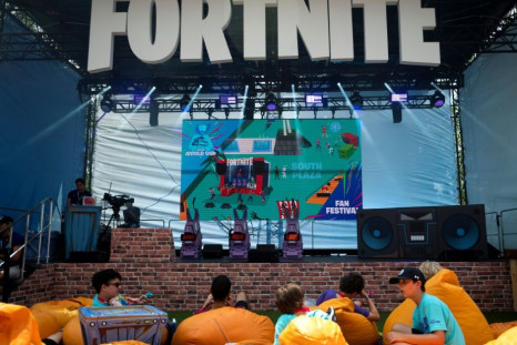 Fans rest on pillows at the 2019 Fortnite World Cup Finals - Round Two at the Arthur Ashe Stadium in New York City in July 2019