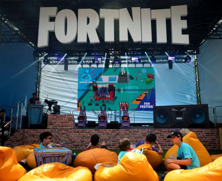 Fans rest on pillows at the 2019 Fortnite World Cup Finals - Round Two at the Arthur Ashe Stadium in New York City in July 2019