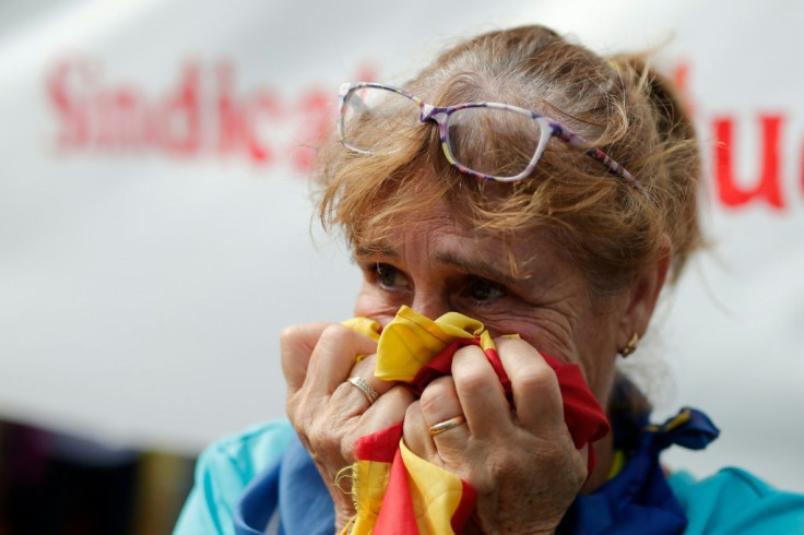 Some said they felt like crying as the verdict came out, with one woman holding back her tears with an Estelada, a Catalan independence flag
