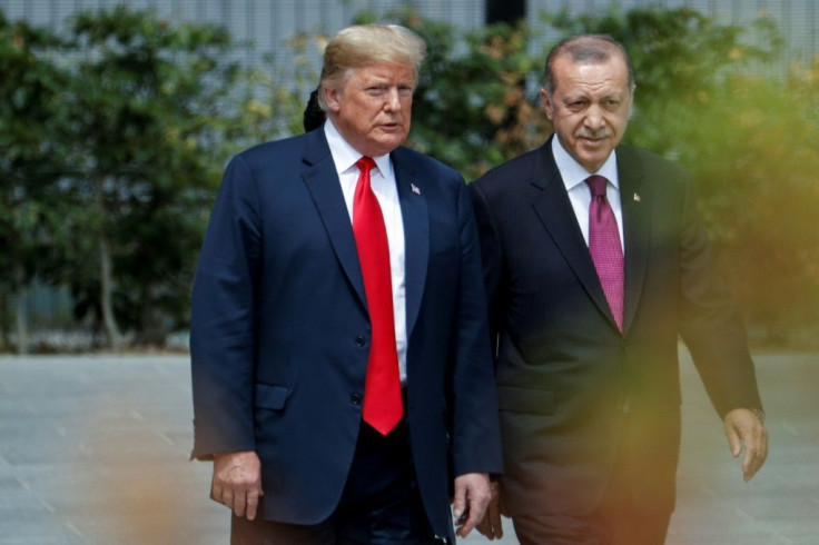 US President Donald Trump strolls with Turkish President Recep Tayyip Erdogan during a July 2018 visit at the NATO headquarters