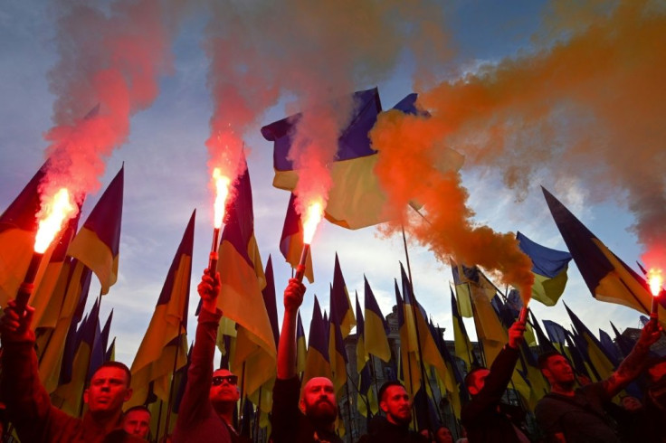 Thousands of protesters, many veterans of the conflict in eastern Ukraine, paraded through the capital with flares burning, singing the national anthem and chanting slogans against President Volodymyr Zelensky