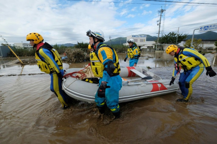 Japanese Prime Minister Shinzo Abe said rescue units "are trying their best" to reach those still unaccounted for after Typhoon Hagibis