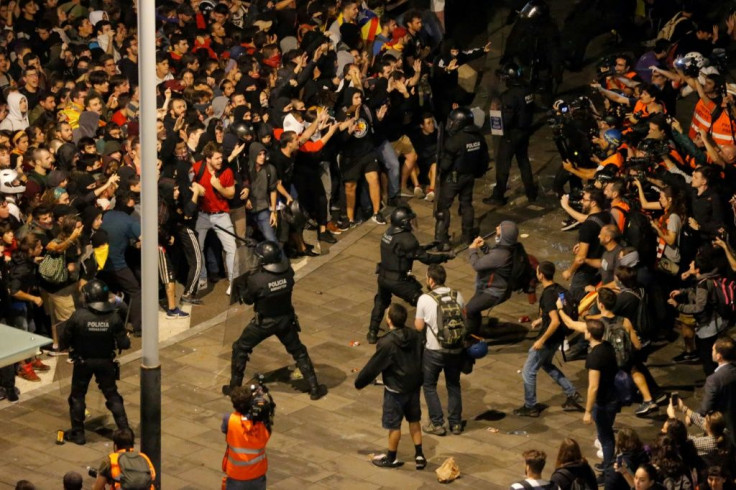 Protesters clash with Spanish policemen outside El Prat airport in Barcelona