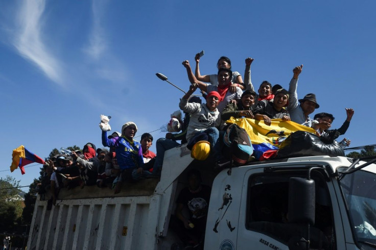 Protesters celebrate as they leave in Quito after Ecuador's president and indigenous leaders reached an agreement to end violent protests