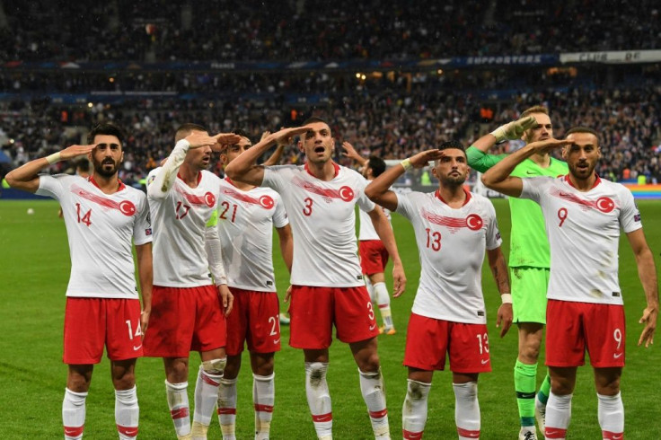 Turkish players perform the controversial military salute after drawing with France amid diplomatic tensions between the two country's