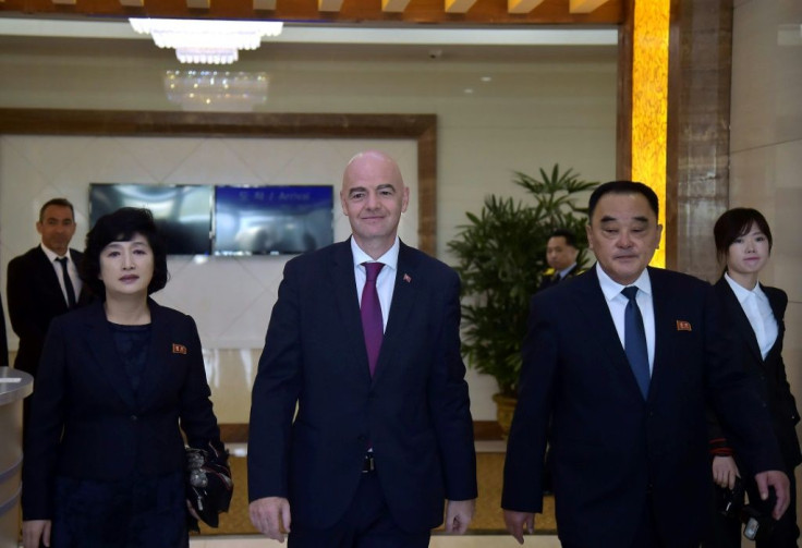 FIFA president Gianni Infantino (C) flew in to Pyongyang and was scheduled to attend the game
