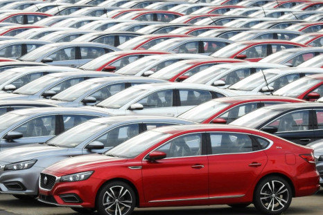 Chinese-made cars waiting to be loaded on a ship for export in Lianyungang, in China's eastern Jiangsu province. The IMF has trimmed China's growth forecast for 2019 on the back of the trade war with the US and weak domestic consumer demand