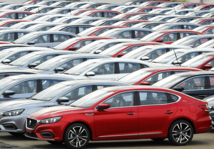 Chinese-made cars waiting to be loaded on a ship for export in Lianyungang, in China's eastern Jiangsu province. The IMF has trimmed China's growth forecast for 2019 on the back of the trade war with the US and weak domestic consumer demand