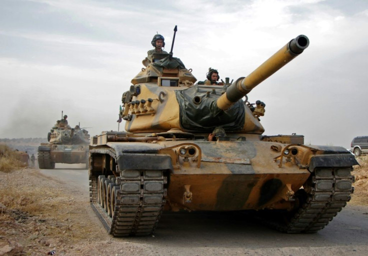Turkish forces advance north of the Syrian city of Manbij as part of a sweeping offensive against the Kurds