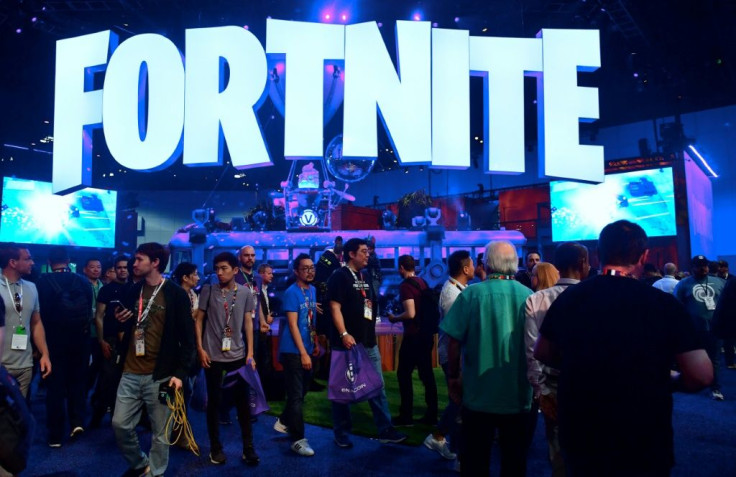 In this file photo taken on June 12, 2018, people crowd the display area for the survival game Fortnite at the 24th Electronic Expo, or E3 2018, in Los Angeles