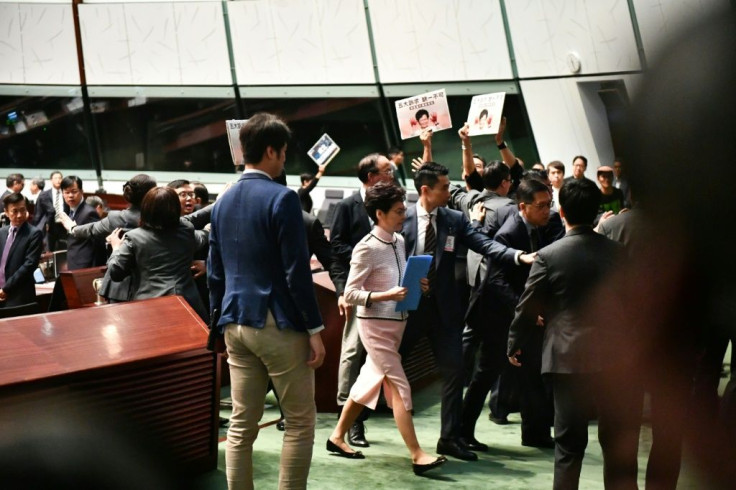 There were chaotic scenes inside Hong Kong's legislature as the city's leader tried to deliver a policy address