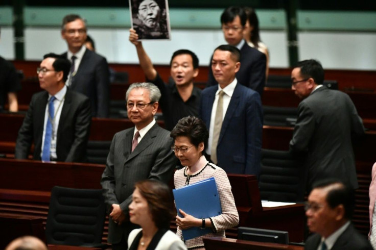 Opposition lawmakers heckled Carrie Lam as she tried to deliver a speech inside the legislature