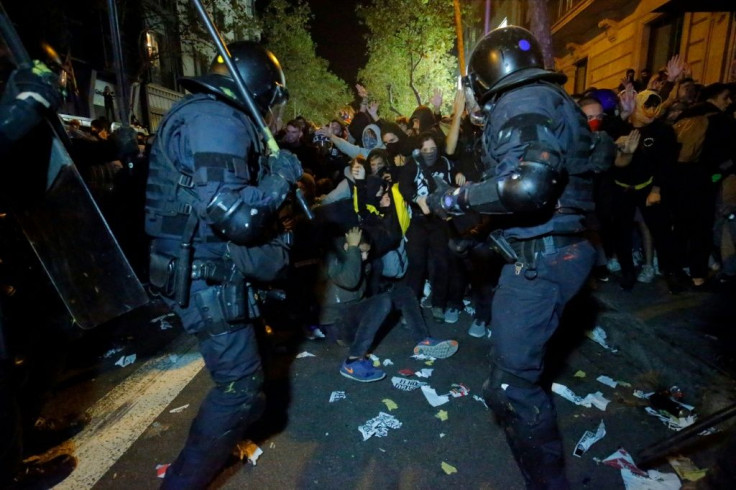 Protesters clashed with Catalan regional police during a protest in front of the Spanish Government delegations in Barcelona