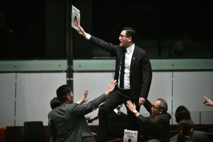 Opposition lawmakers heckled Carrie Lam as she tried to deliver a speech inside the legislature