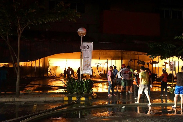 TV footage showed firemen battling a raging blaze that engulfed the three-storey Gaisano shopping mall after the quake
