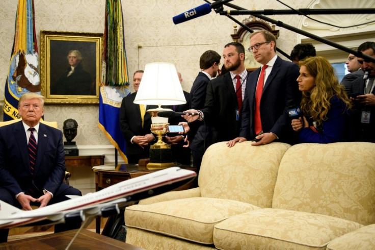 US President Donald Trump meets with Italian President Sergio Mattarella (not pictured) in the Oval Office and said a partial trade deal with China is being 'papered'