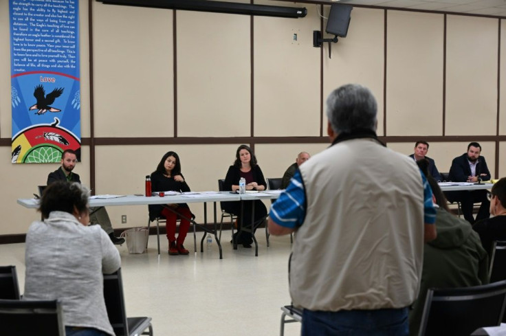 A member of the Curve Lake First Nation ask questions at a meeting with political candidates for the federal election in Curve Lake, Canada