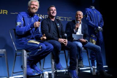 From left to right, Richard Branson, founder of Virgin Galactic, Kevin Plank, head of Under Armour and Stephen Attenborough, Virgin Galactic commercial director, are seen during the presentation of the company's new space suits near New York