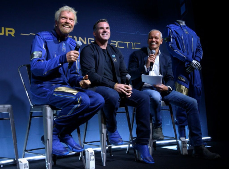 From left to right, Richard Branson, founder of Virgin Galactic, Kevin Plank, head of Under Armour and Stephen Attenborough, Virgin Galactic commercial director, are seen during the presentation of the company's new space suits near New York