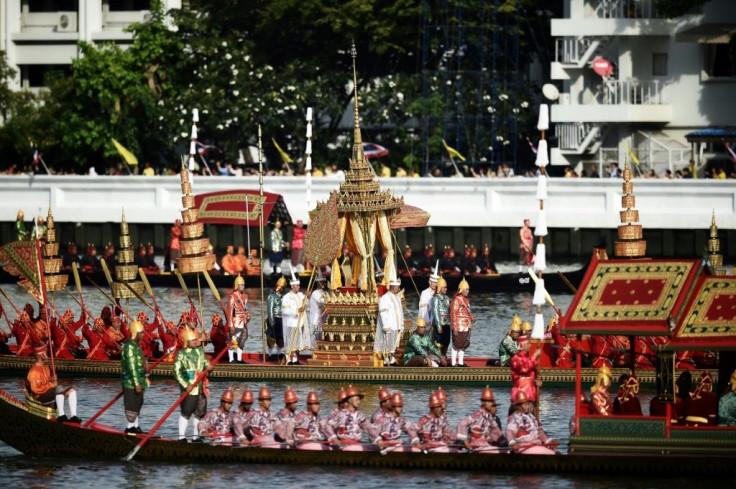 Thai oarsmen row during the first full dress rehearsal for the Royal barge ceremony along the Chao Phraya river in Bangkok