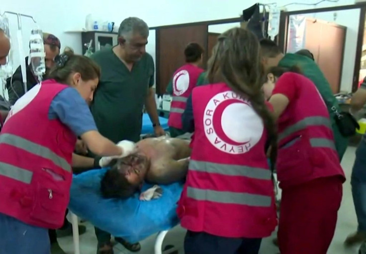 The Syrian Observatory for Human Rights said nearly 500 people have been killed, mostly on the Kurdish side. Shown here are Syrian Kurdish doctors treating the wounded